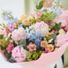 Peonies plus coordinating flowers in shades of peach, blush and lemon with