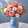 A delicate garden-inspired arrangement featuring soft blush pink roses, pink alstroemeria, white