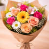 A cheerful hand-designed bouquet created with a fresh mix of seasonal flowers