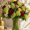 A lush and romantic arrangement featuring vibrant green hydrangea, premium red and