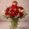 A romantic arrangement of fresh roses accented with delicate butterflies and a