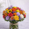  Description: A vibrant and joyful arrangement featuring bright yellow roses, bold