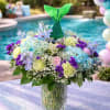 A whimsical and enchanting arrangement inspired by an underwater garden, featuring lush