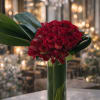 A luxurious and romantic arrangement featuring premium red roses and elegant red