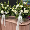 Two matching white floral arrangements that read as serene and refined-perfect as