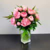Pink peony bouquet in a clear glass vase