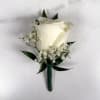 One white standard, full-sized rose with baby's breath makes up this classic