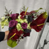 A romantic blend of luxurious anthuriums and fresh florals, designed to create