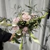 Soft blush roses and sculptural white calla lilies come together in an
