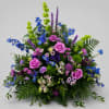 A dramatic, garden-style sympathy and celebration arrangement, Lavender Meadow Tribute brings together