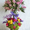 This is a beautiful vibrant tiered topiary arrangement with alstroemerias on top