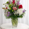 Tall and airy with a joyful mix of color, this flower arrangement