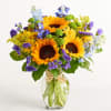 Bright, sunlit sunflowers take center stage in this summertime flower arrangement, making
