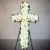 White rose cross on a standing easel