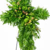 A dignified standing cross formed entirely from lush green foliage creates a