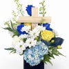Fresh flowers in blue vase 
Woden cross