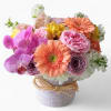 Beautiful and filled with blush pink and white roses orchids and more