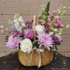 Beautiful medium hand basket with premium florals great foe any occasion. 