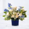 Sapphire is a refined blue and white floral arrangement designed with ivory