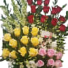 A lush, celebratory arrangement bursting with red, pink, and yellow roses-perfect for