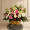 Soft pink roses and pale lilies mingle with white daisies and blush