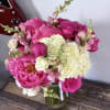Pink and white flower bouquet in a glass vase