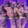 A low, sprawling centerpiece designed for weddings and special events, this pink