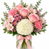 A soft and elegant arrangement designed to brighten any occasion.Featuring blush pink