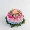 A pink-and-white floral "cake" arrangement shaped like a celebration centerpiece-perfect as a