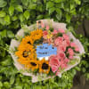 A sweet mix of sunny blooms and soft pink petals, made to