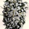A large, formal sympathy arrangement crafted to offer quiet comfort and reverence