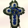 A formal sympathy cross crafted to convey reverence and comfort, arranged on