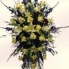 A tall, formal sympathy spray arranged to honor a life with quiet