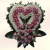 A soft, heart-shaped sympathy arrangement crafted to say goodbye with tenderness: this
