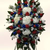 A striking standing spray in red, white &amp; blue that reads as