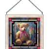 A sweet plush teddy bear with a pink ribbon is the heart