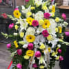 Medium Sympathy spray pink, yellow, and white
Includes Roses, carnations, Lilies, Hydrangeas
Metal stand