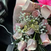 Pink rose bouquet with baby's breath and a gold butterfly decoration