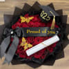 A cluster of red long stemmed red roses wrapped with black mesh