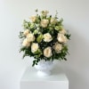 A full dome of white and cream roses, accented with alstroemeria, chrysanthemums