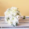 White bouquet with roses, daisies, and calla lilies