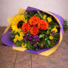 Bouquet of orange roses and a sunflower wrapped in purple and yellow paper