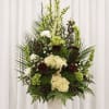 Tall, layered white hydrangeas and architectural greenery make an immediate, comforting impression-this
