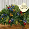 A bold, personalized casket spray that reads like a proud farewell: this
