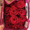 Box of red roses in a pink gift box