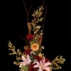 Tall floral arrangement with red roses, pink lilies, and peach daisies