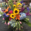 A bright funeral arrangement to remind those that even though dark times
