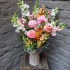 A stunning arrangement of soaring snapdragons and radiant ranunculus, all grown locally