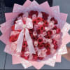 A lush dome of red and pink roses makes a bold romantic