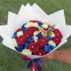 A boldly patriotic bouquet built from tightly packed red, blue, and white